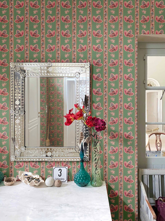 Serafina Stripe is a green floral striped wallpaper shown on the walls of a hallway