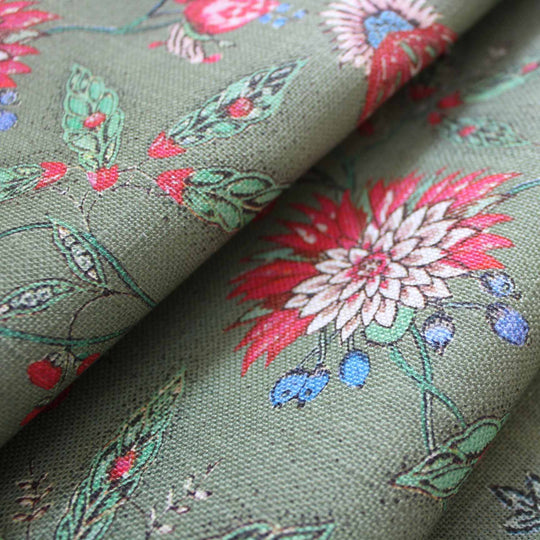 Amalita floral fabric in moss green featuring pink and blue flowers, inspired by 18th century design.