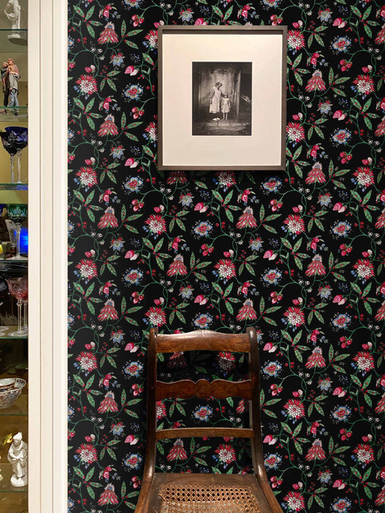Black wallpaper with pink, green and blue french floral design