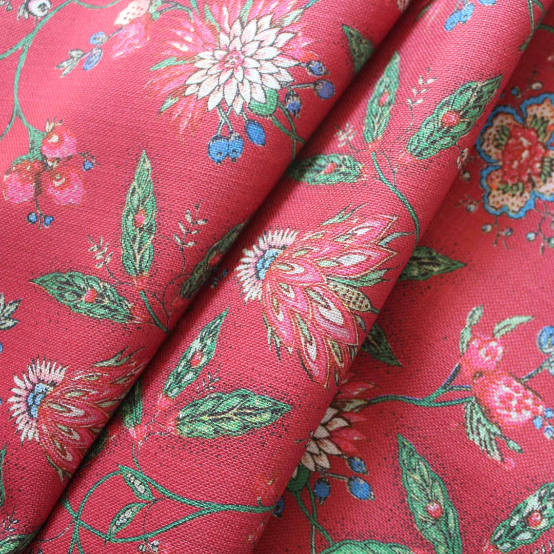 Amalita Floral Fabric in fuchsia red showcasing indienne inspired floral design with pink, blue, and green accents.