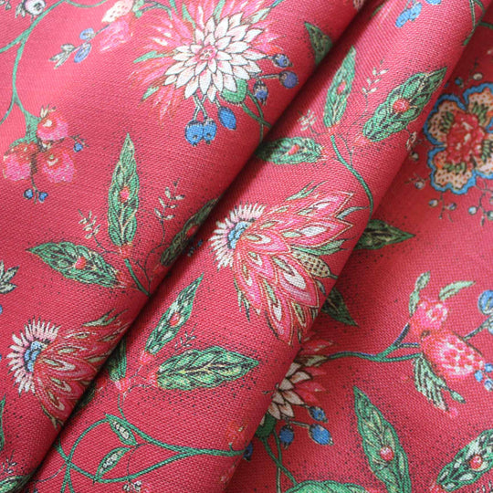 Amalita Floral Fabric in fuchsia red showcasing indienne inspired floral design with pink, blue, and green accents.