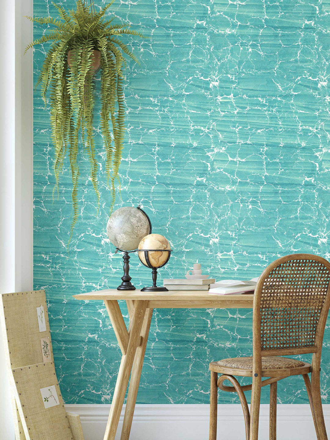 A statement aqua blue marbled wallpaper mimicing rippling water on an interior wall