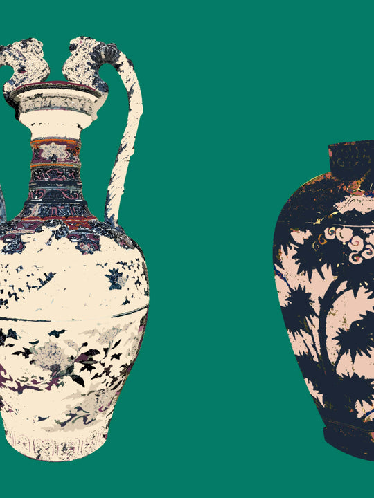 A boutique home wallpaper sample close up featuring two ornate ceramic vases with intricate designs on a emerald green background