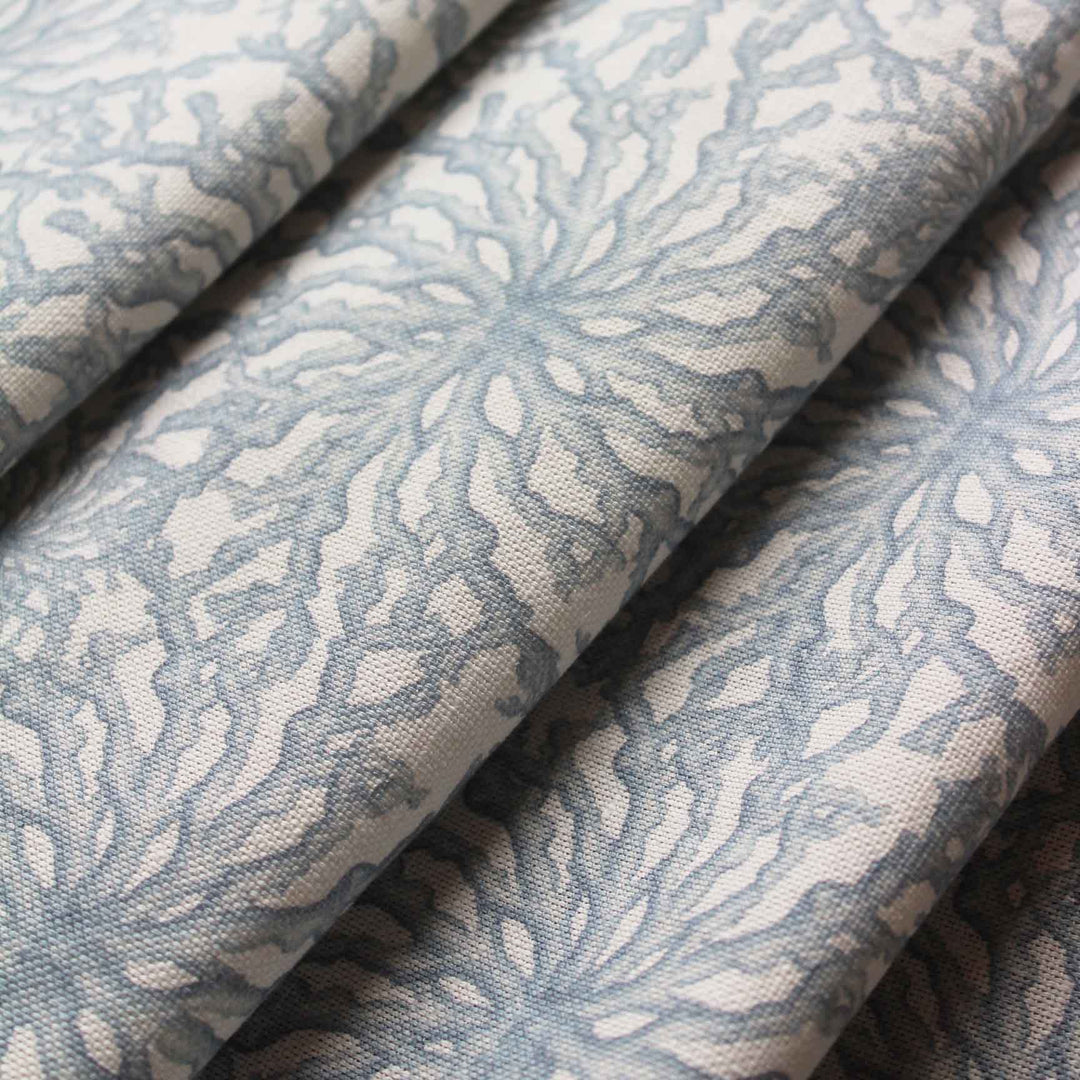 Designer curtain fabric with a delicate coral design in pale blue and white by Milola Design
