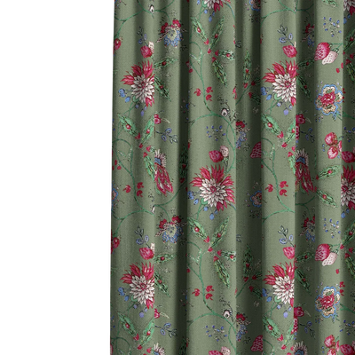 Floral patterned fabric on a green background