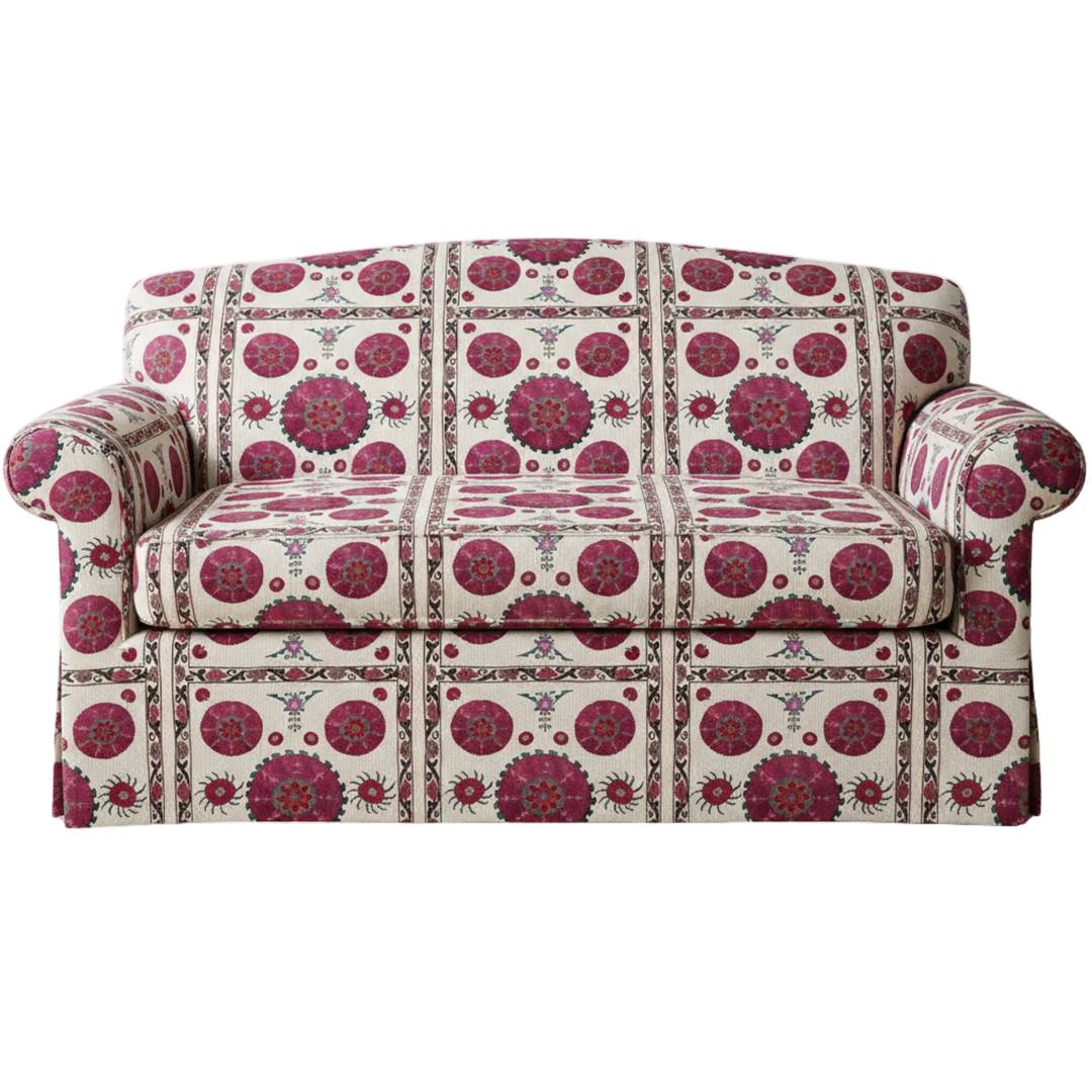 Patterned sofa with pink and red design on a white background for bohemian interiors