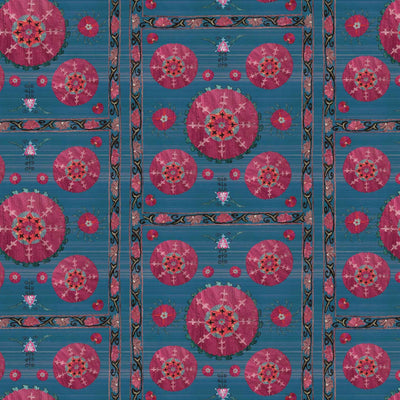 Azure blue Suzani grasscloth wallpaper featuring intricate floral motifs and geometric patterns in vibrant pink.