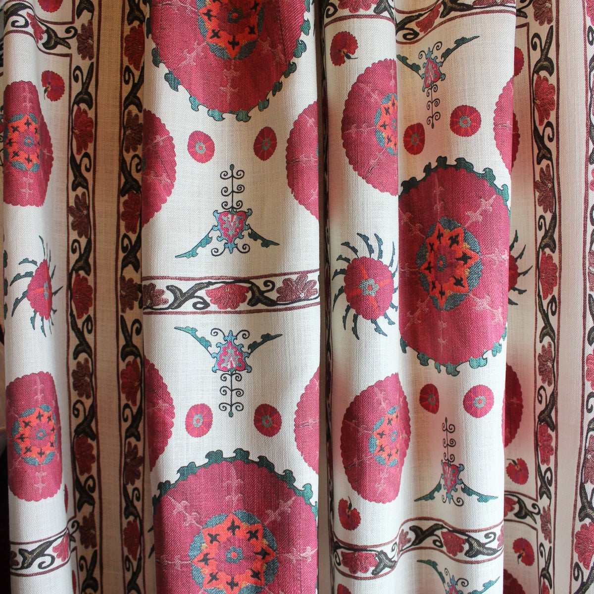 Curtain with red floral pattern on a white background