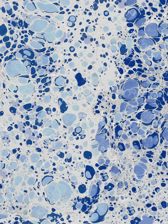 Home wallpaper with a marbled pattern in blue and white 