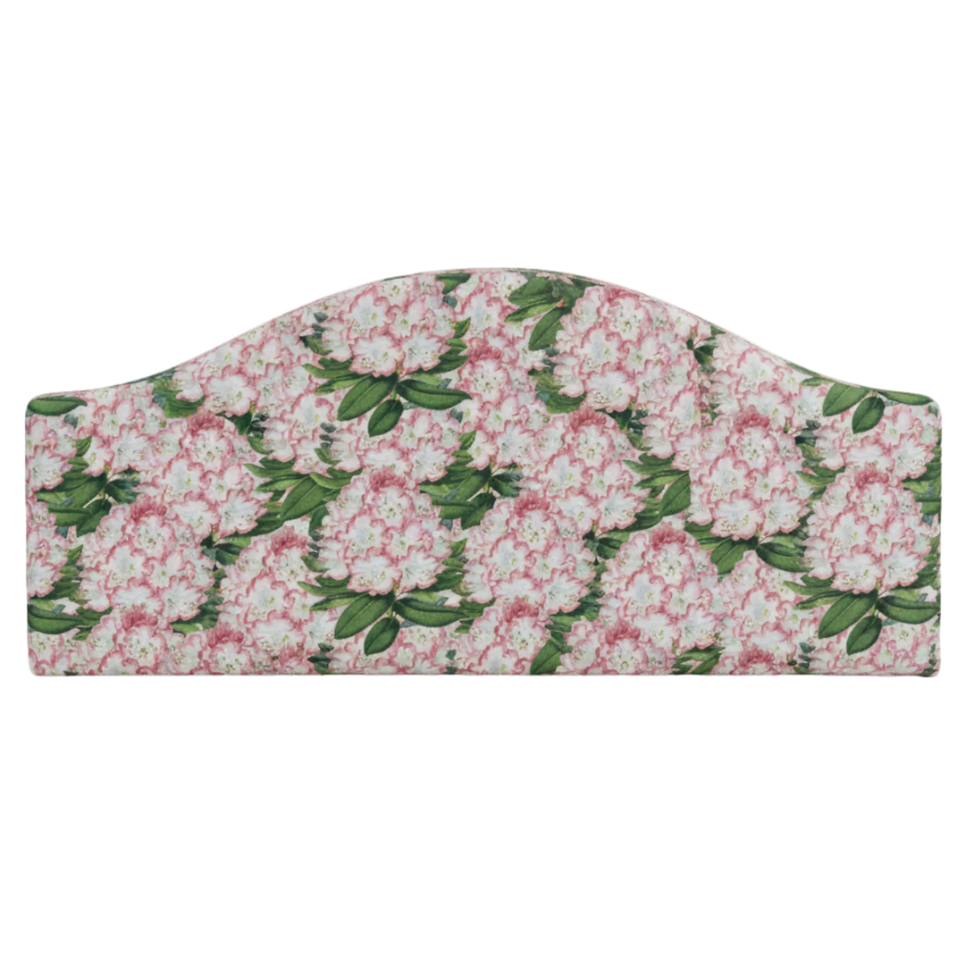 Floral spring patterned fabric headboard on a white background
