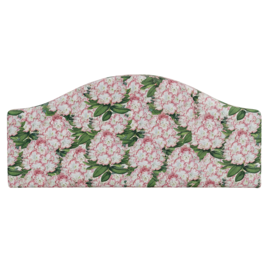 Floral spring patterned fabric headboard on a white background