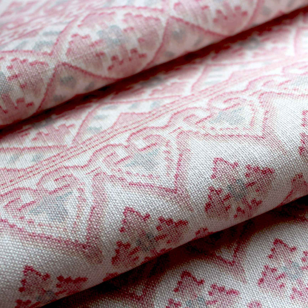 A printed pink patterned stripe fabric with a bohemian style by Milola design