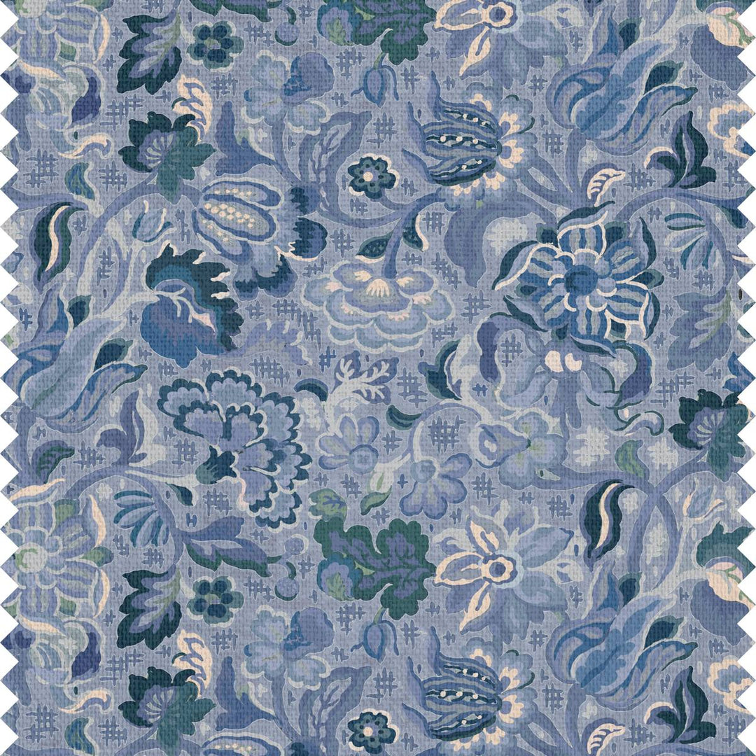 Fabric and wallpaper with a whimsical blue floral motif and swirling leaf patterns.