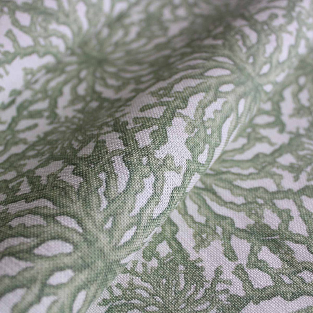 Sage green designer linen curtain fabric featuring a delicate coral pattern by Milola Design.