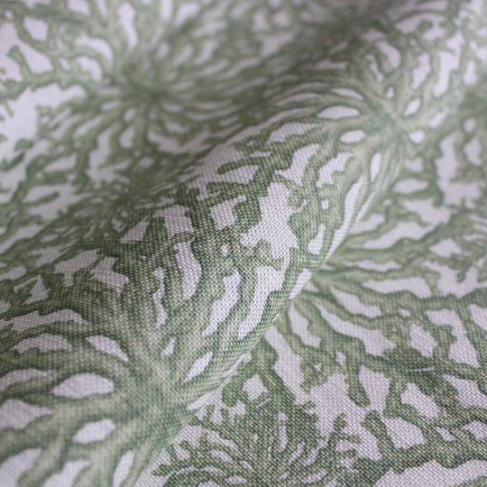 Sage green designer linen curtain fabric featuring a delicate coral pattern by Milola Design.