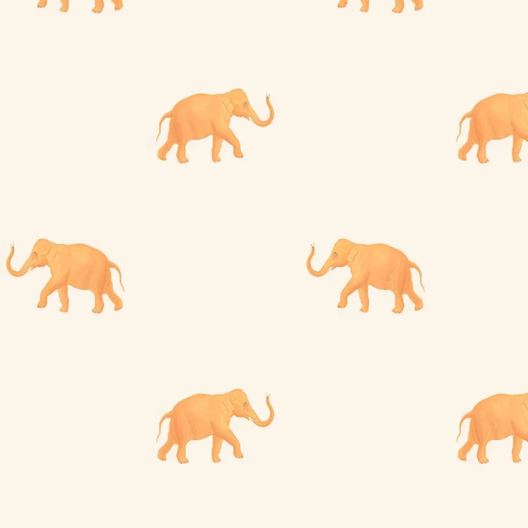 Orange elephant wallpaper with a cream background on a kids bedroom wall
