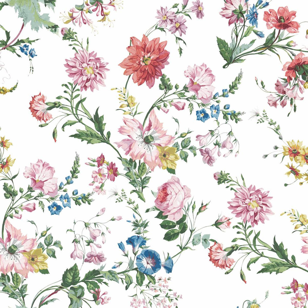 A floral wallpaper bursting with flowers in pinks, blues and yellows on a white background giving a vintage, granny vibe to bedroom or bathroom walls