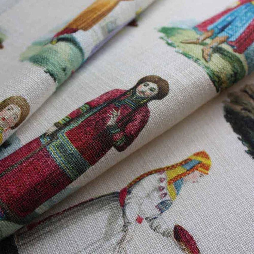 An eclectic printed curtain fabric with figures representing historic Russian costumes by Milola Design