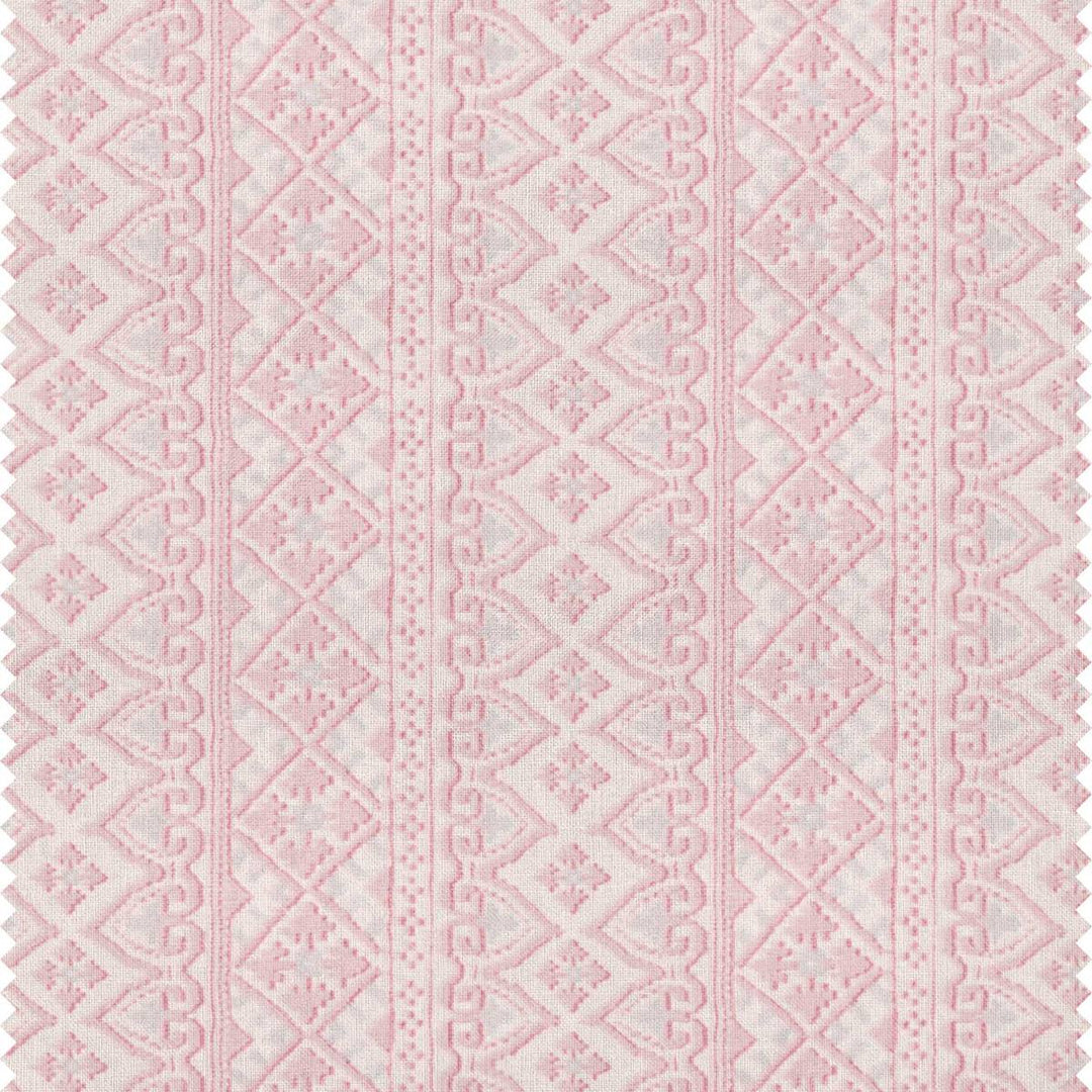 A printed pink patterned stripe fabric with a bohemian style by Milola design