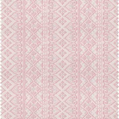 A printed pink patterned stripe fabric with a bohemian style by Milola design