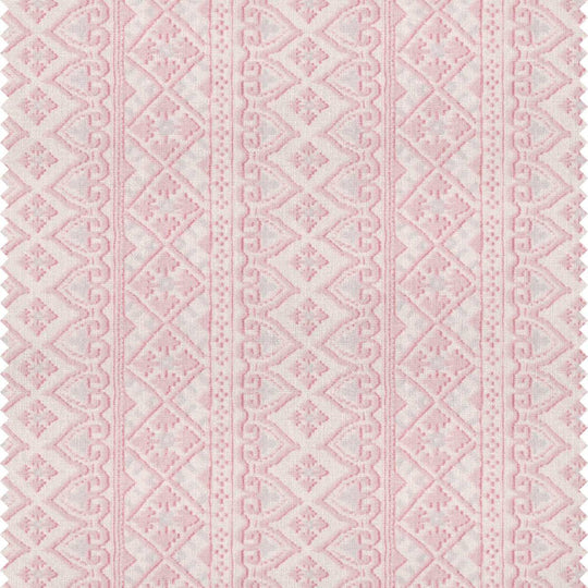 A printed pink patterned stripe fabric with a bohemian style by Milola design