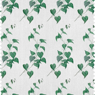 Botanical fabric design featuring trailing green vine leaves on a off white background by Milola Design.