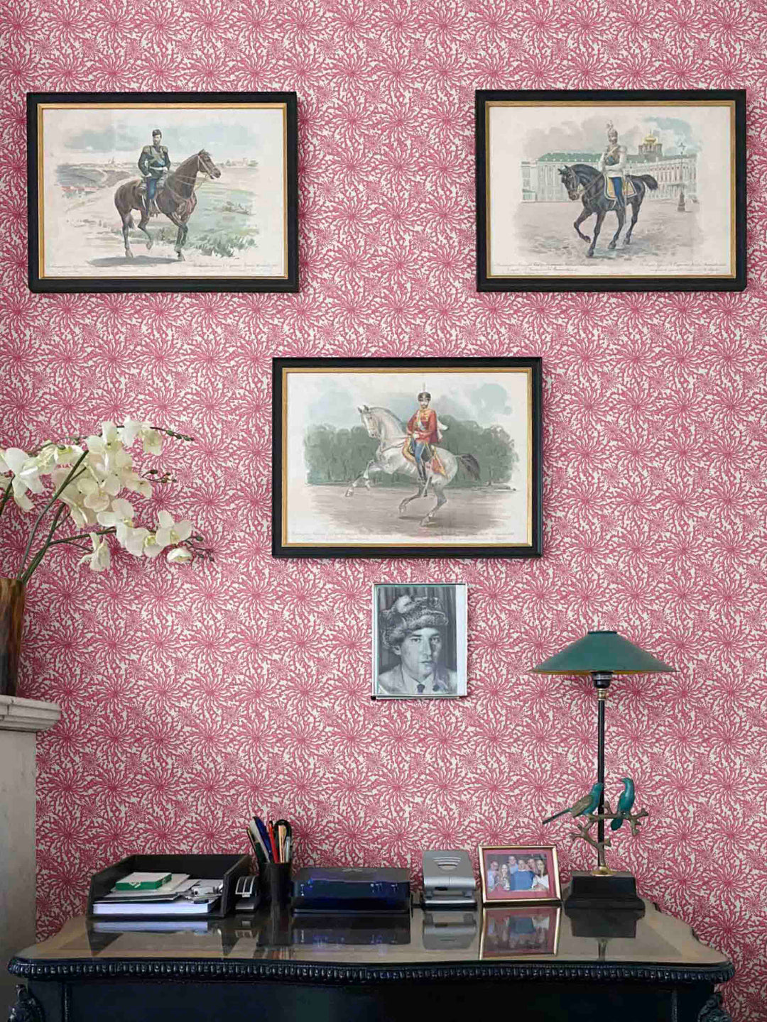 a study decorated in dark pink coral patterned wallpaper by milola design