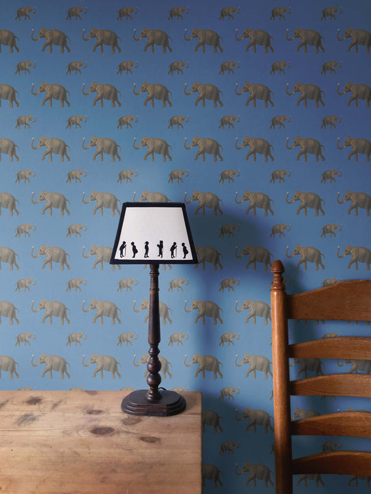 Elegant elephant wallpaper with a dark blue background in bedroom by Milola Design