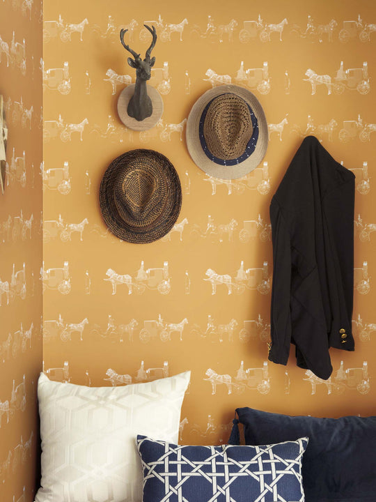 Equestrian wallpaper featuring horse and carriages in  mustard yellow and while in a cloakroom