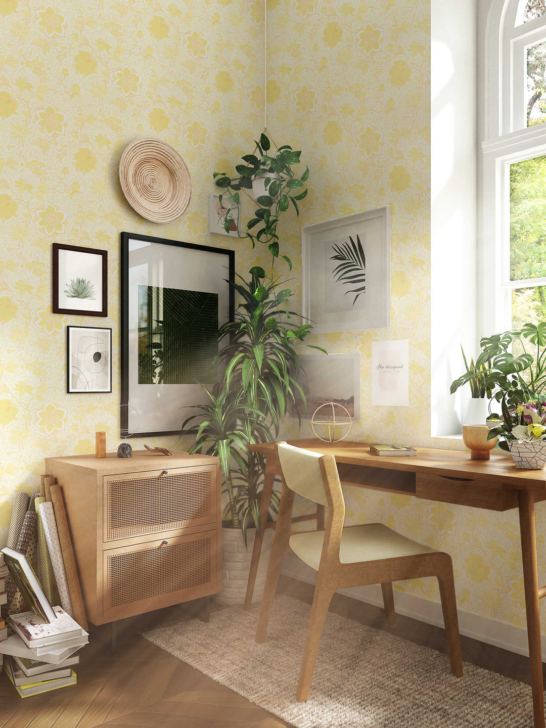 A buttermilk yellow floral wallpaper with a pattern of blossoms and birds, displayed in a study room setting.