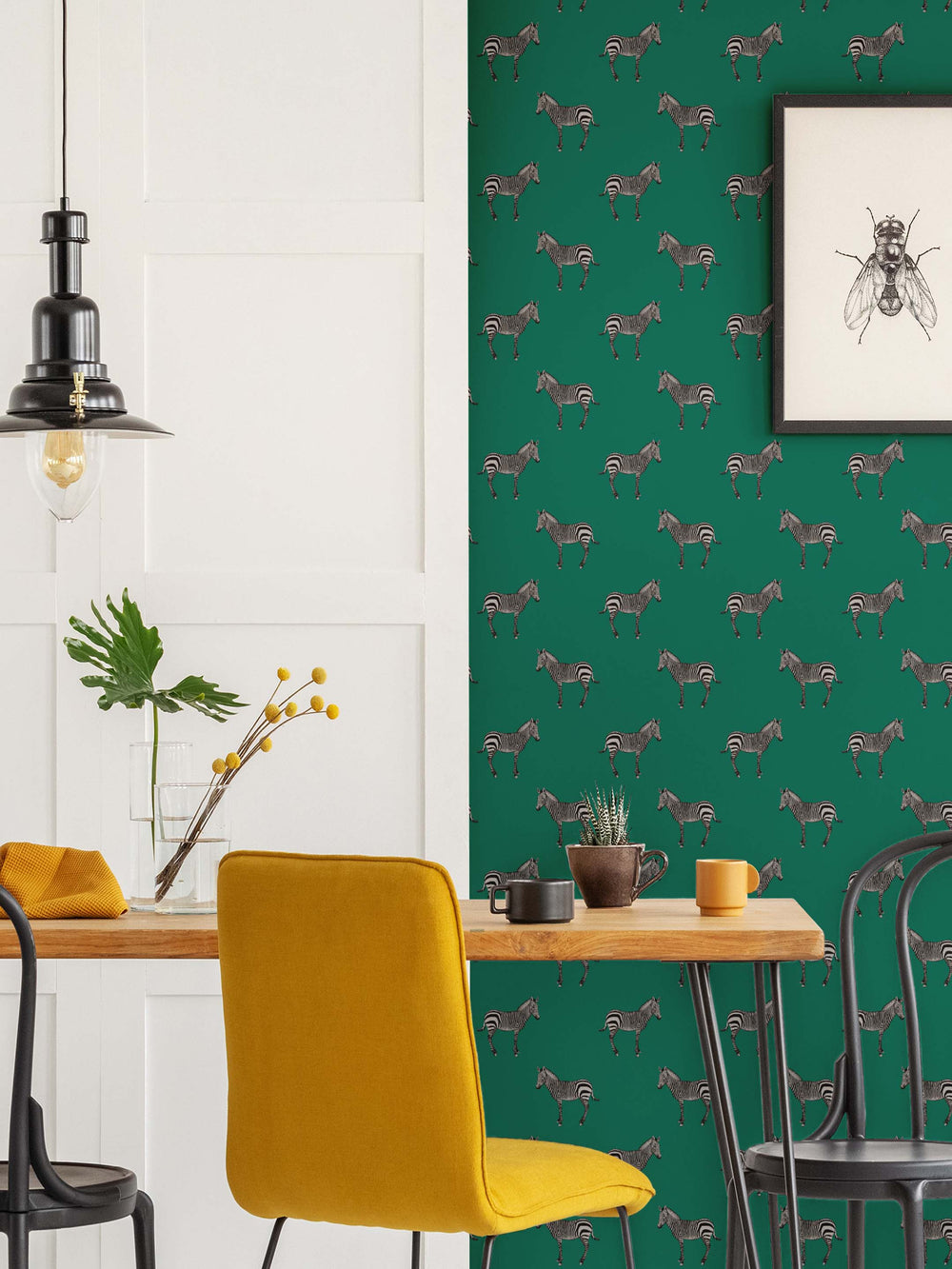 A emerald green zebra patterned wallpaper in a kitchen with table and chairs by Milola Design