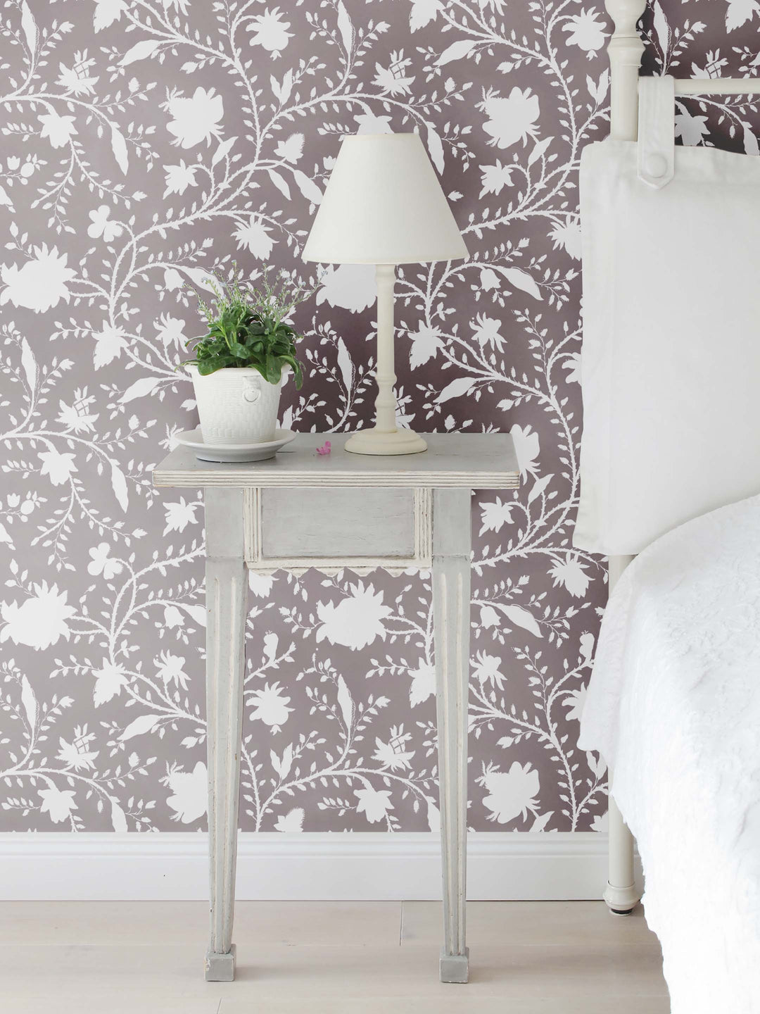 bedroom with dark mauve and white floral wallpaper by Milola Design
